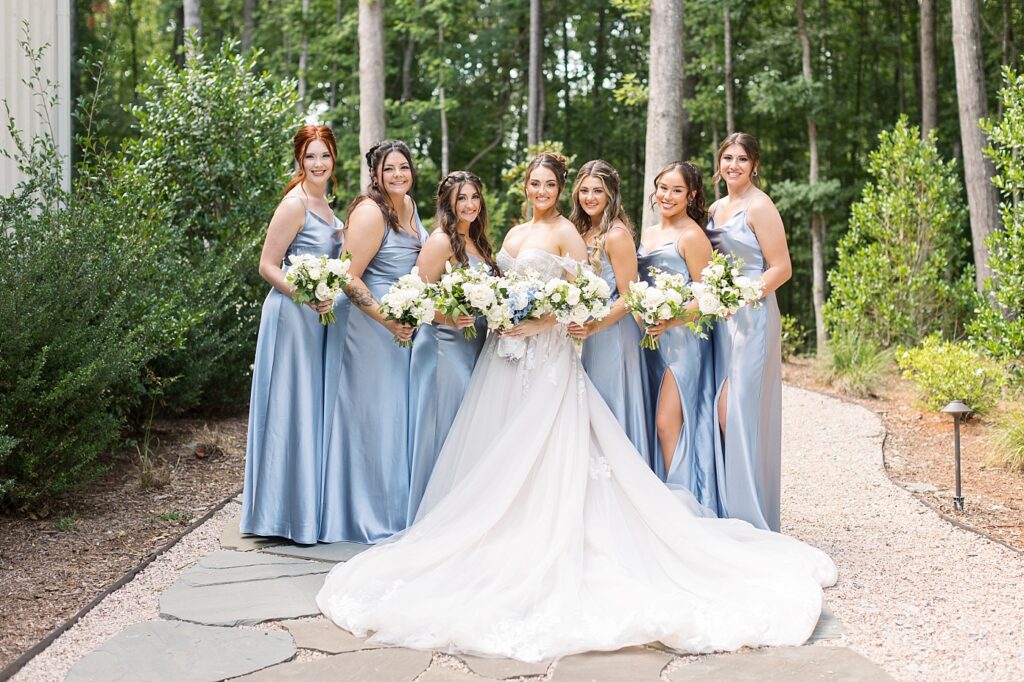 Bride with bridesmaids on gravel path | Blue and white Wedding | Carolina Groves Wedding | Carolina Groves Wedding Photographer | Raleigh NC Wedding Photographer