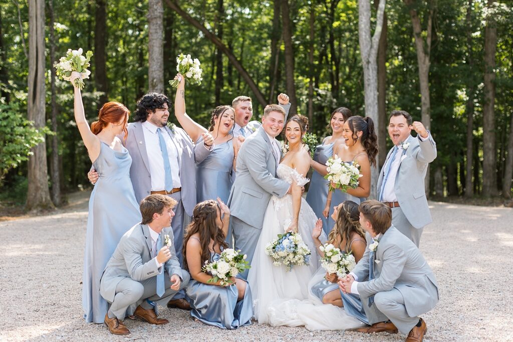 Bride and groom with wedding party cheering | Blue and white Wedding | Carolina Groves Wedding | Carolina Groves Wedding Photographer | Raleigh NC Wedding Photographer