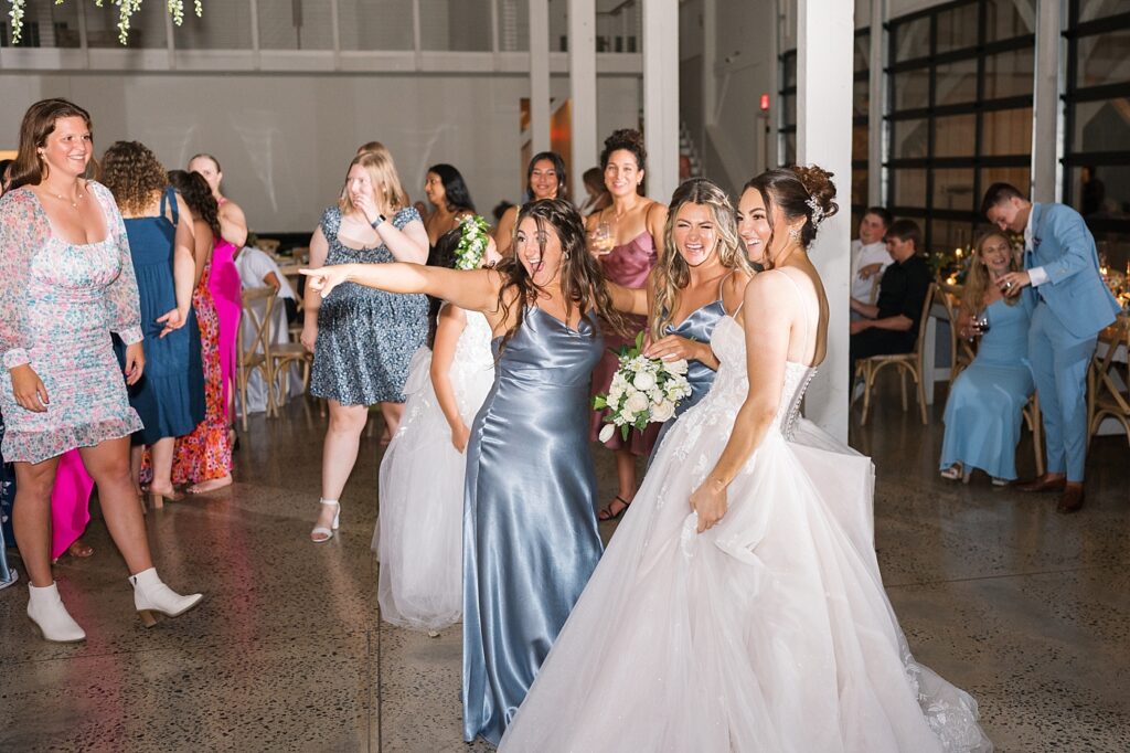 Bride dancing with bridesmaids | Blue and white Wedding | Carolina Groves Wedding | Carolina Groves Wedding Photographer | Raleigh NC Wedding Photographer