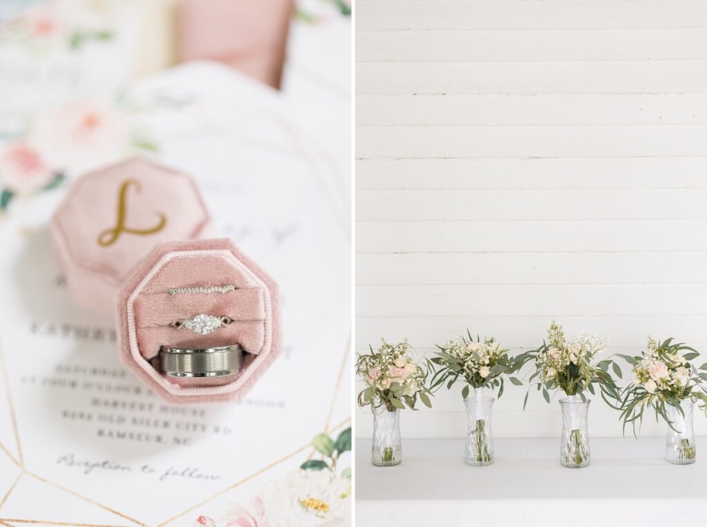 Wedding rings in pink ring box displayed on top of wedding invitations and flower arrangements | Rustic wedding | Harvest House Wedding | Harvest House Photographer | Raleigh NC Wedding Photographer