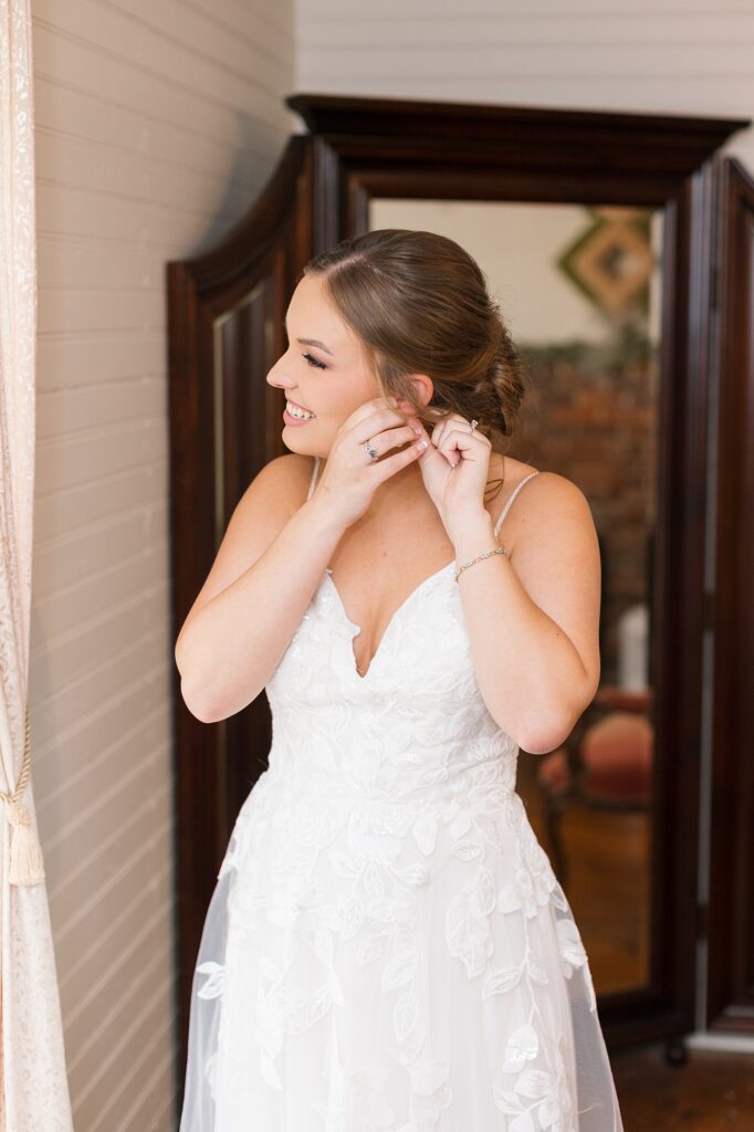 Bride putting on her earrings | Rustic wedding | Harvest House Wedding | Harvest House Photographer | Raleigh NC Wedding Photographer