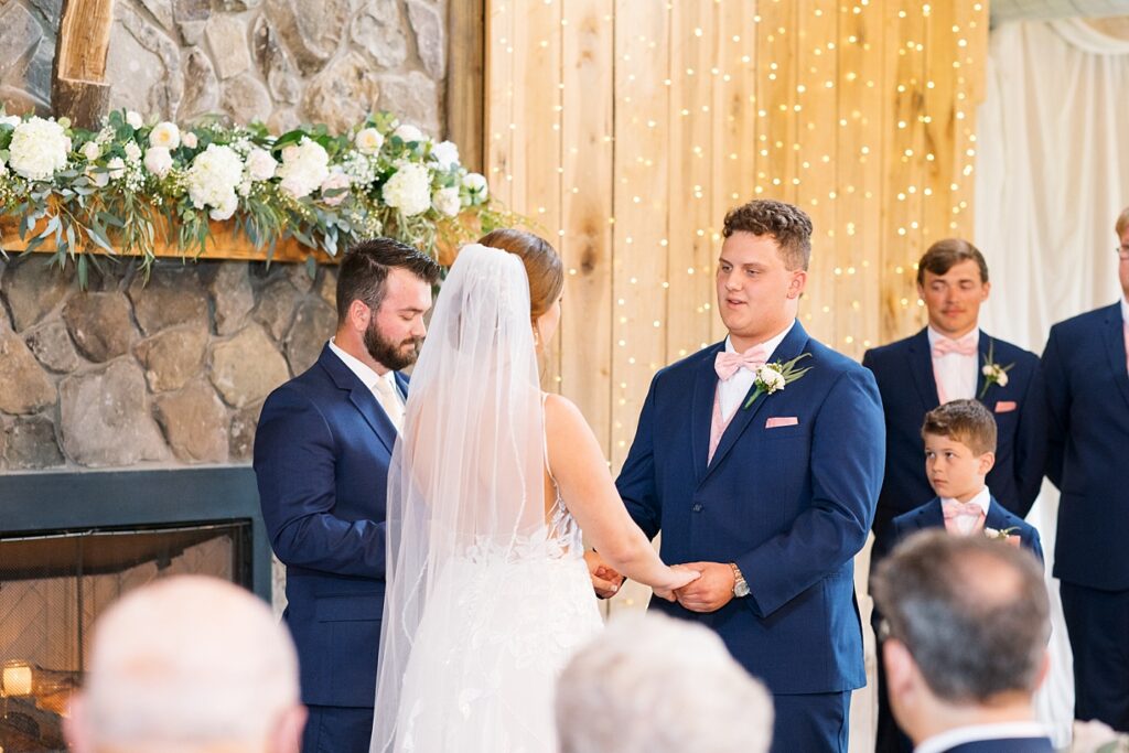 Bride and groom holding hands during wedding ceremony | Rustic wedding | Harvest House Wedding | Harvest House Photographer | Raleigh NC Wedding Photographer