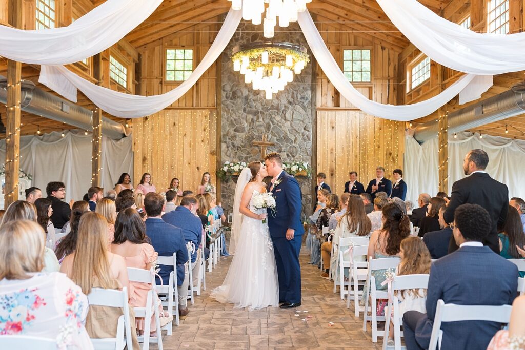 Bride and groom kissing after wedding ceremony | Rustic wedding | Harvest House Wedding | Harvest House Photographer | Raleigh NC Wedding Photographer
