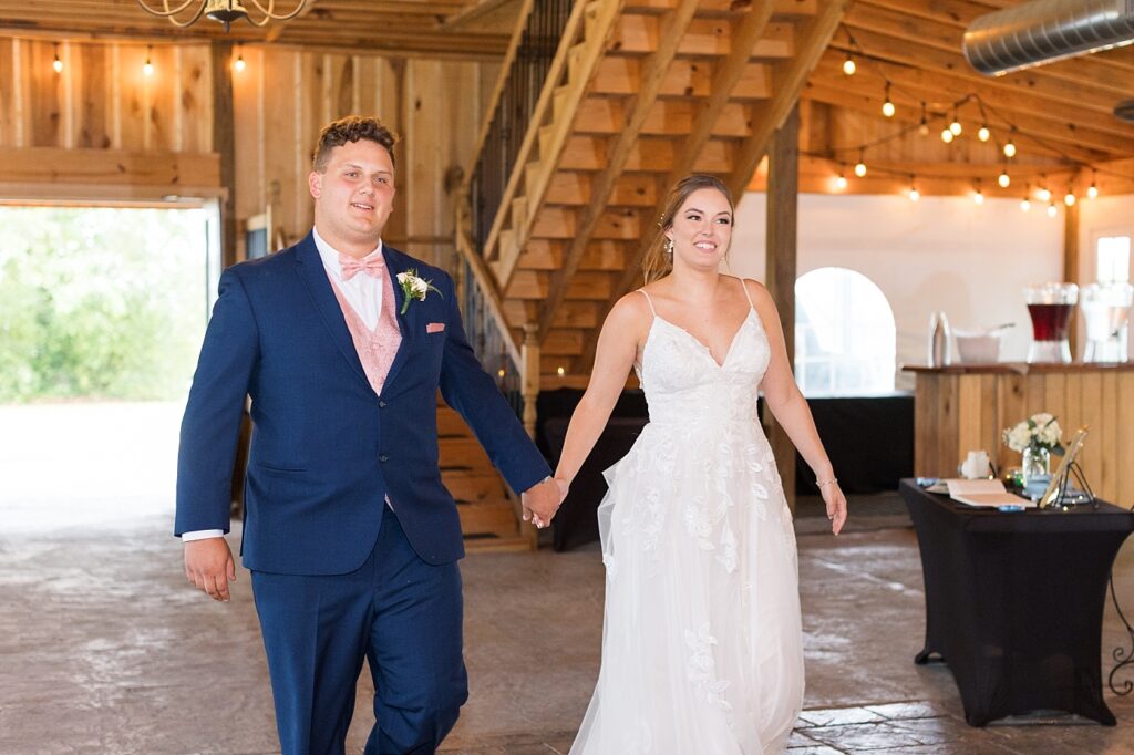 Bride and groom walking into wedding reception | Rustic wedding | Harvest House Wedding | Harvest House Photographer | Raleigh NC Wedding Photographer