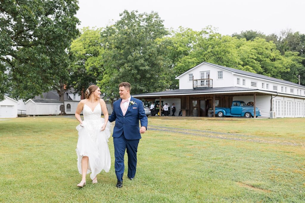 Bride and groom walking in field | Rustic wedding | Harvest House Wedding | Harvest House Photographer | Raleigh NC Wedding Photographer