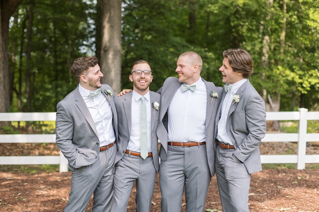 Groom smiling with groomsmen | Rustic Wedding | Twin Oaks Barn Wedding | Twin Oaks Barn Wedding Photographer | Raleigh NC Wedding Photographer