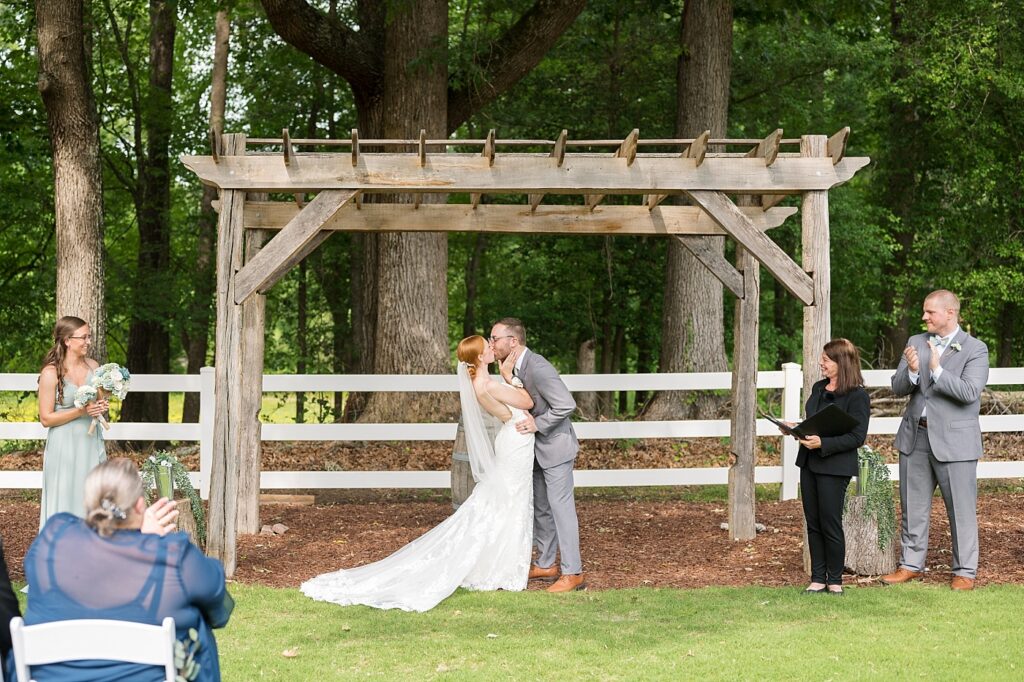 Bride and groom first kiss after wedding ceremony | Rustic Wedding | Twin Oaks Barn Wedding | Twin Oaks Barn Wedding Photographer | Raleigh NC Wedding Photographer