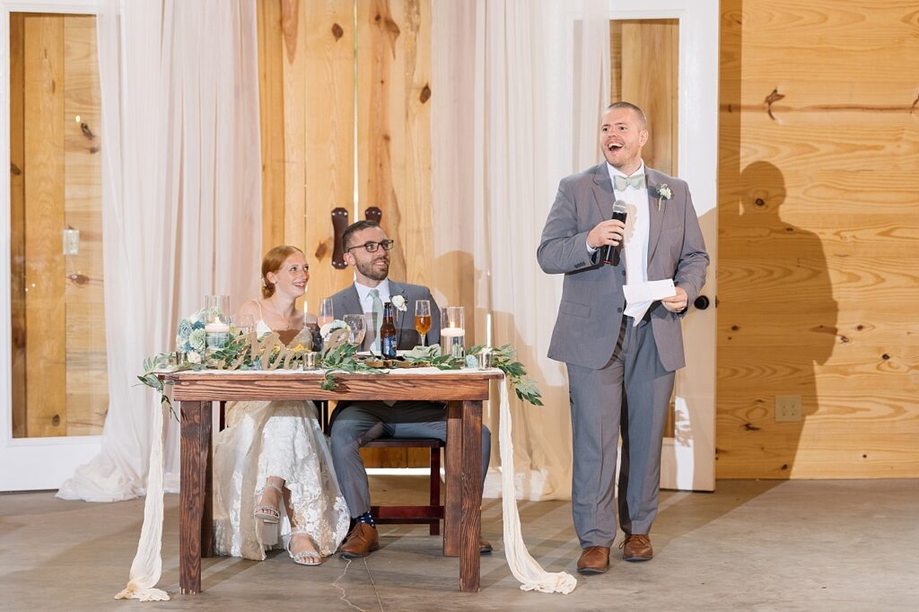 Groomsmen giving wedding toast | Rustic Wedding | Twin Oaks Barn Wedding | Twin Oaks Barn Wedding Photographer | Raleigh NC Wedding Photographer