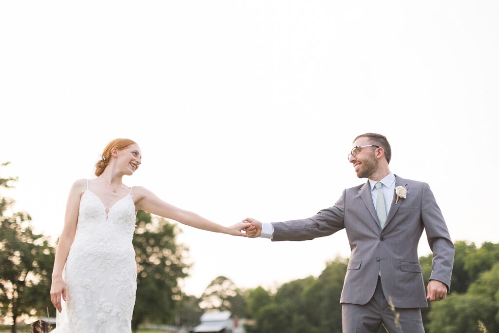 Bride and groom holding hands | Rustic Wedding | Twin Oaks Barn Wedding | Twin Oaks Barn Wedding Photographer | Raleigh NC Wedding Photographer