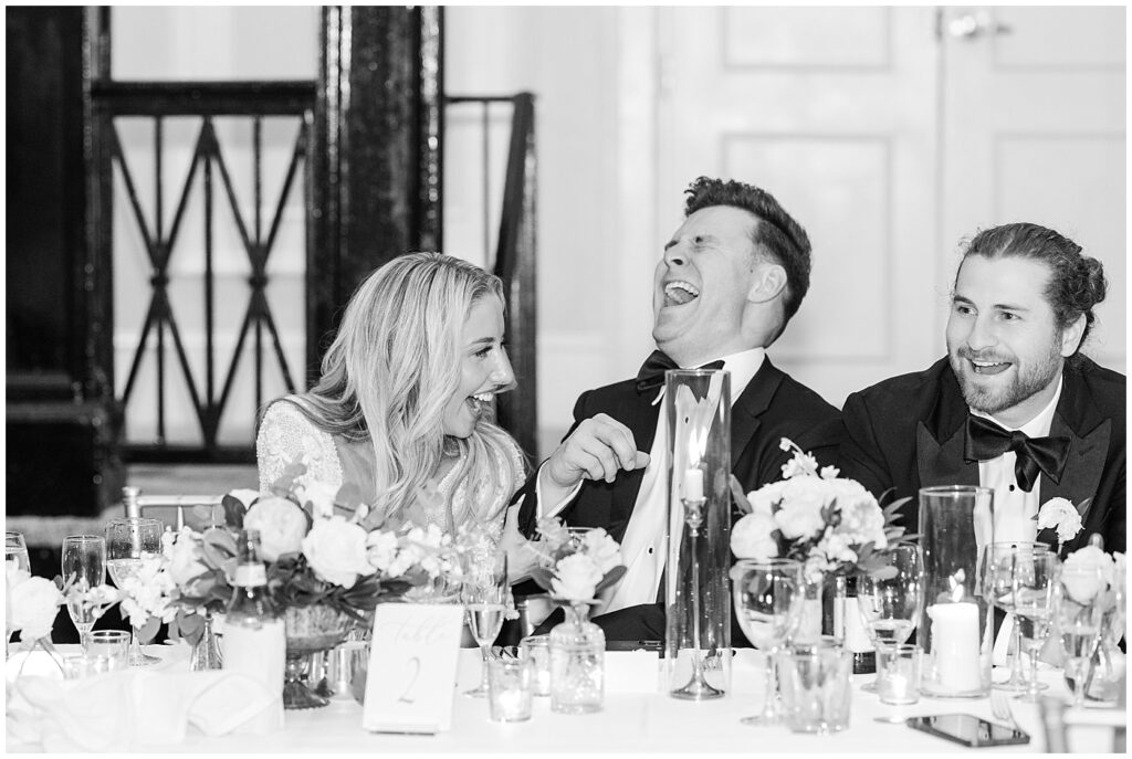 Bride and groom laughing during toast | Classic Summer Wedding | Wedding with Neutrals | Carolina Inn Wedding on The Lawn | UNC Alumni Wedding | Raleigh Wedding Photographer | NC Wedding Photographer