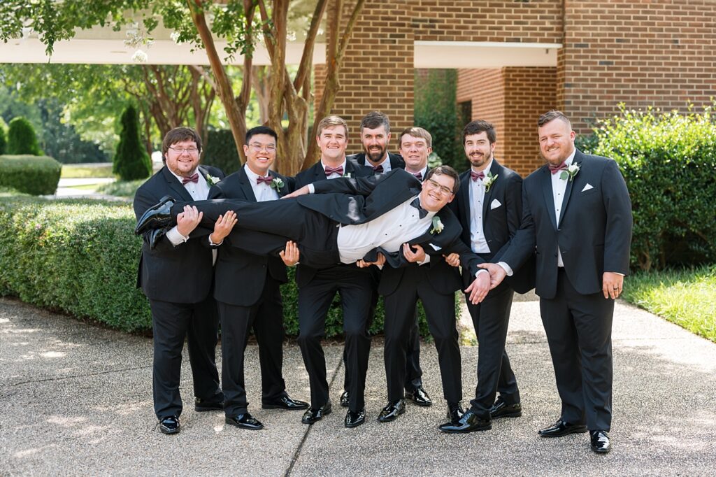 Groomsmen carrying groom | Summer Wedding | The Matthews House Wedding | The Matthews House Wedding Photographer | Raleigh NC Wedding Photographer