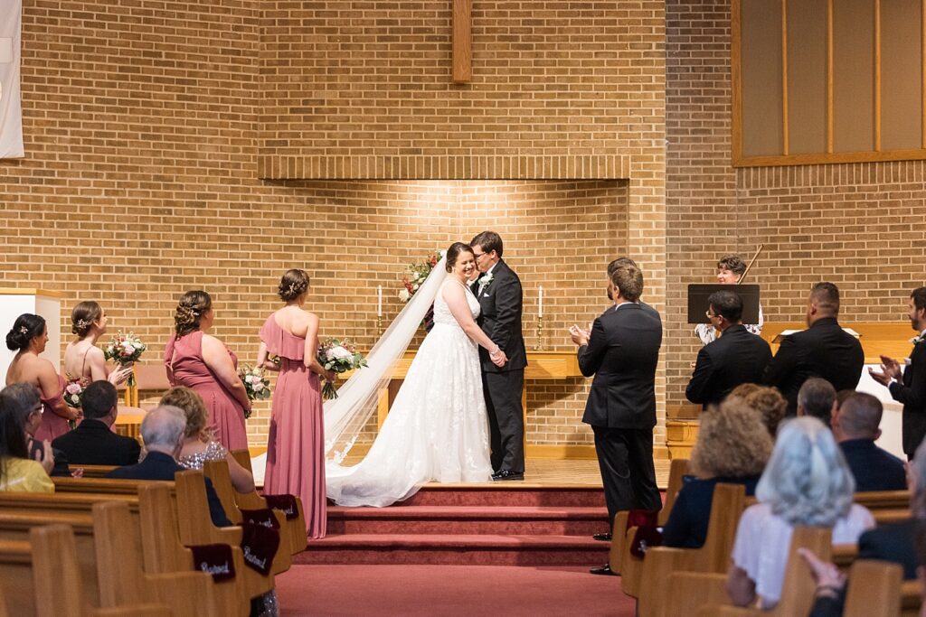 Groom kissing bride during wedding ceremony | Summer Wedding | The Matthews House Wedding | The Matthews House Wedding Photographer | Raleigh NC Wedding Photographer