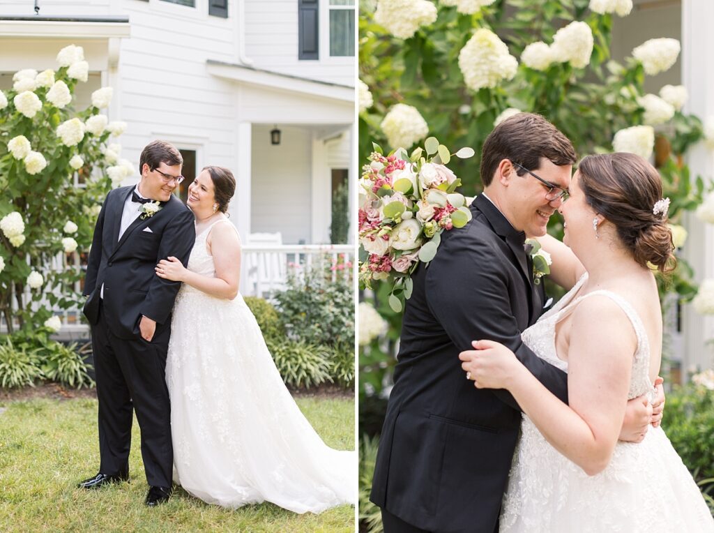 Bride and groom embracing in garden by white flowers | Summer Wedding | The Matthews House Wedding | The Matthews House Wedding Photographer | Raleigh NC Wedding Photographer