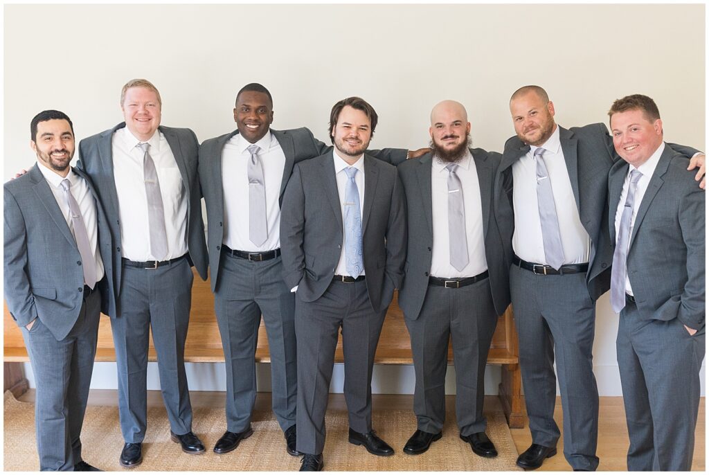 Groom smiling with groomsmen | Caffe Luna Wedding | Caffe Luna Wedding Photographer | Raleigh NC Wedding Photographer