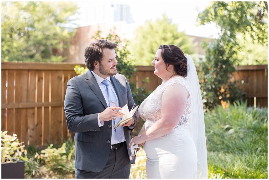 Groom reading vows to bride during first look at The Guest House | Caffe Luna Wedding | Caffe Luna Wedding Photographer | Raleigh NC Wedding Photographer