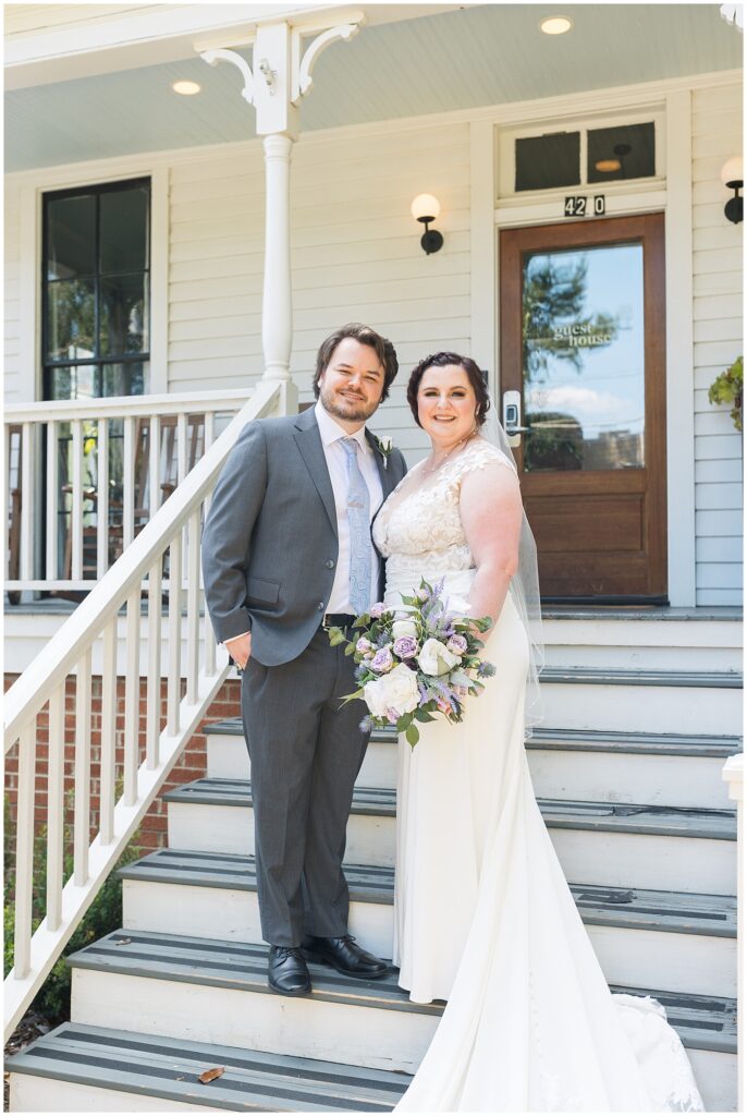 Bride and groom standing by stairs | Caffe Luna Wedding | Caffe Luna Wedding Photographer | Raleigh NC Wedding Photographer