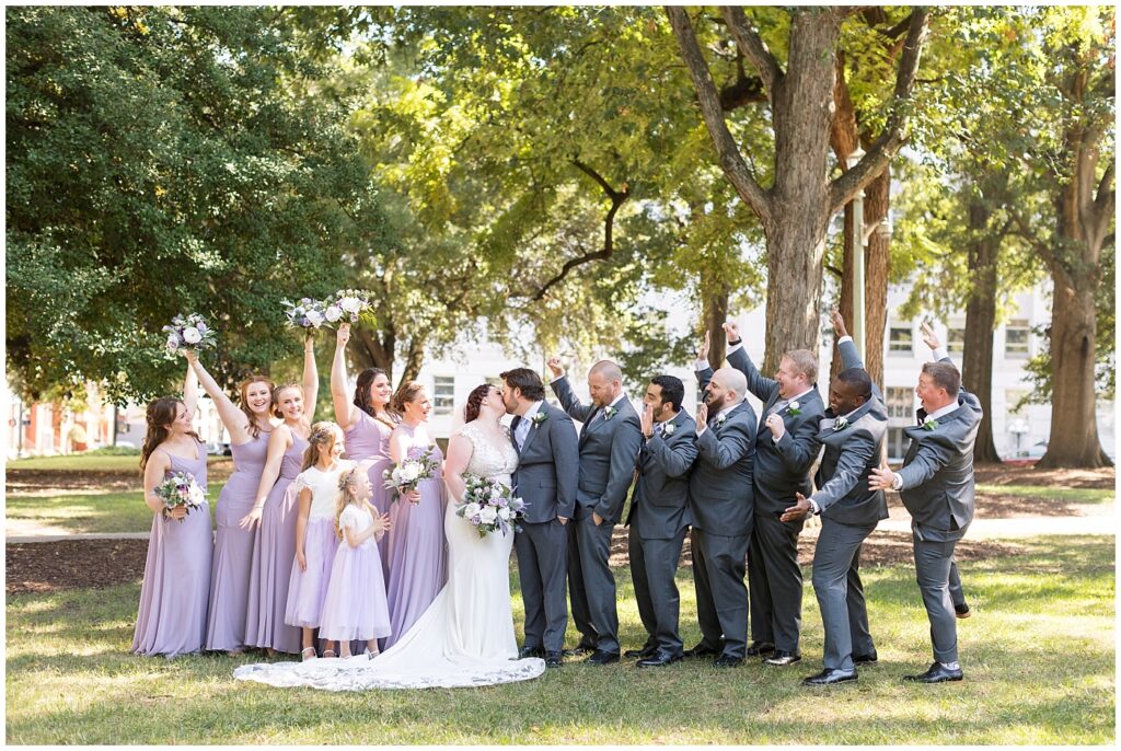 Wedding party cheering bride and groom | Caffe Luna Wedding | Caffe Luna Wedding Photographer | Raleigh NC Wedding Photographer