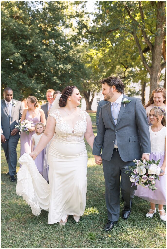 Bride and groom holding hands | Caffe Luna Wedding | Caffe Luna Wedding Photographer | Raleigh NC Wedding Photographer