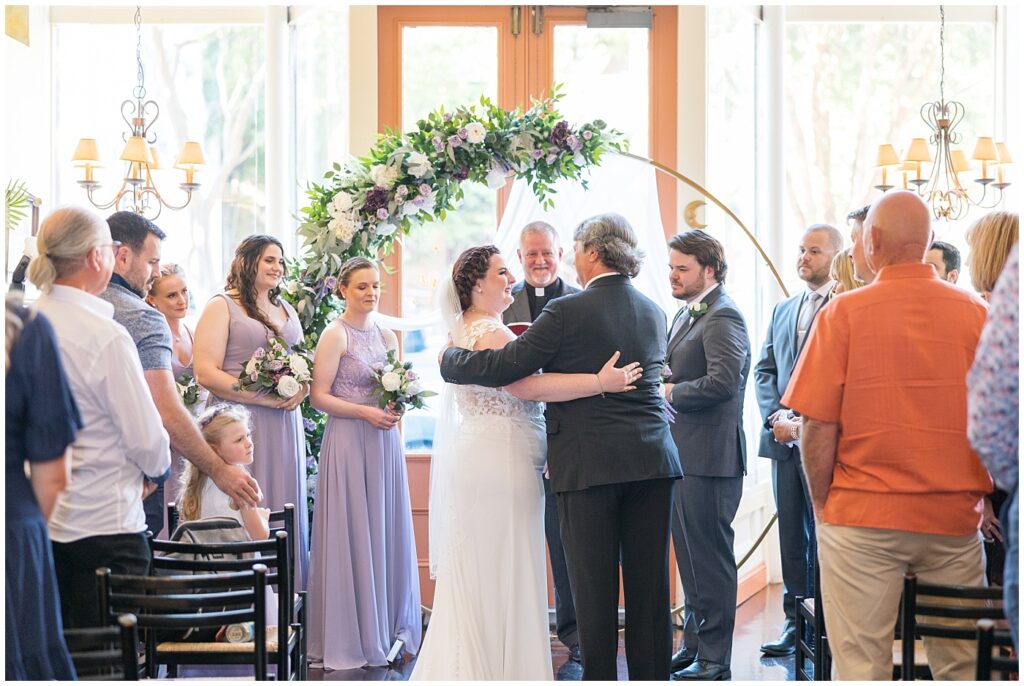 Father of bride embracing bride | Caffe Luna Wedding | Caffe Luna Wedding Photographer | Raleigh NC Wedding Photographer