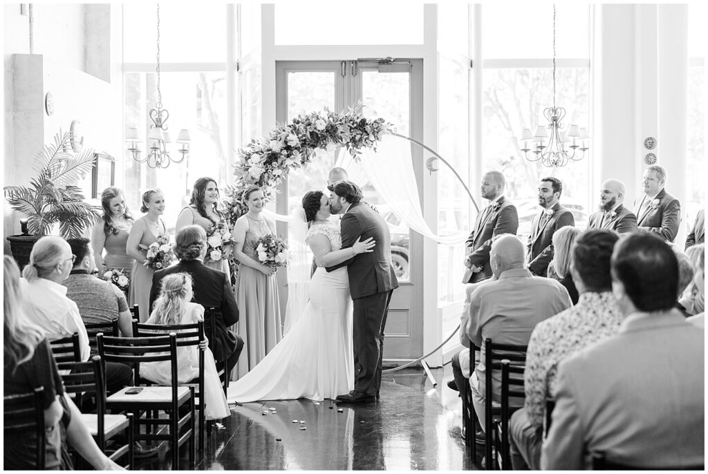 Bride and groom's first kiss after wedding ceremony | Caffe Luna Wedding | Caffe Luna Wedding Photographer | Raleigh NC Wedding Photographer