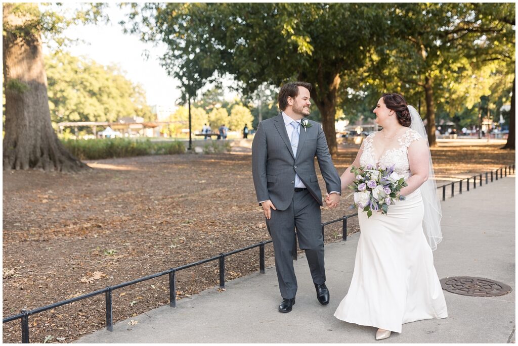 Bride and groom holding hands | Caffe Luna Wedding | Caffe Luna Wedding Photographer | Raleigh NC Wedding Photographer
