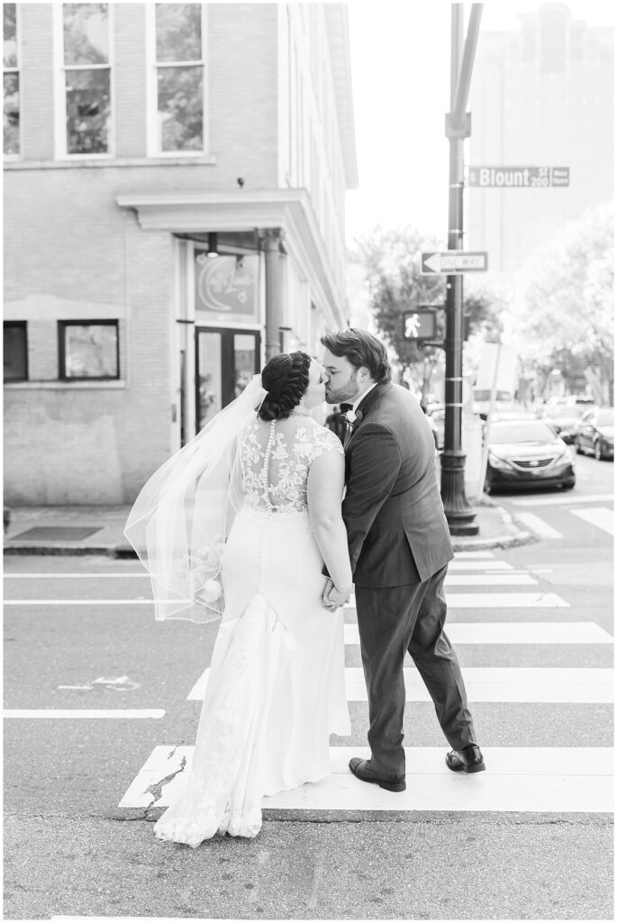 Bride and groom kissing on Blount St | Caffe Luna Wedding | Caffe Luna Wedding Photographer | Raleigh NC Wedding Photographer