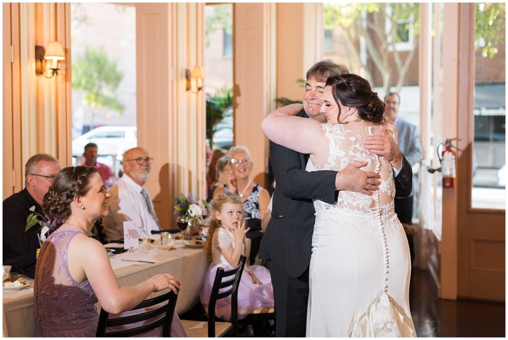 Bride and father of the bride hugging after wedding toast | Caffe Luna Wedding | Caffe Luna Wedding Photographer | Raleigh NC Wedding Photographer