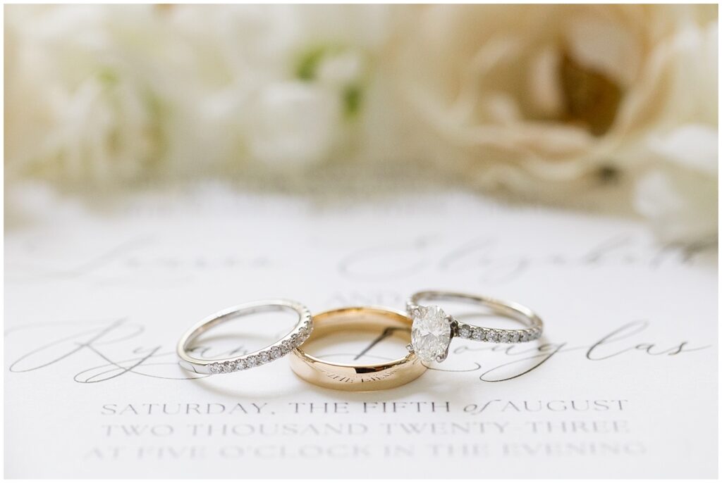 Wedding rings displayed on wedding invitation | Summer Wedding | Angus Barn Wedding | Angus Barn Wedding Photographer | Raleigh NC Wedding Photographer