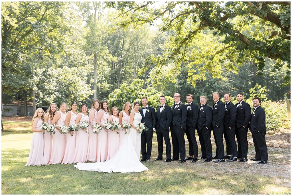 Bride and groom with wedding party | Summer Wedding | Angus Barn Wedding | Angus Barn Wedding Photographer | Raleigh NC Wedding Photographer