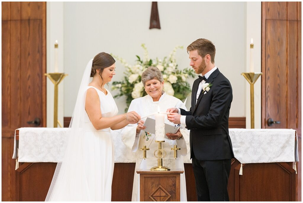 Bride and groom lighting unity candle during wedding ceremony | Summer Wedding | Angus Barn Wedding | Angus Barn Wedding Photographer | Raleigh NC Wedding Photographer