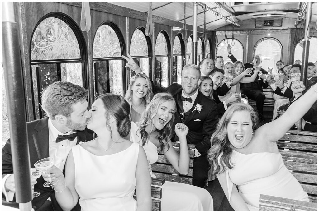 Wedding party sitting inside Raleigh trolley | Summer Wedding | Angus Barn Wedding | Angus Barn Wedding Photographer | Raleigh NC Wedding Photographer