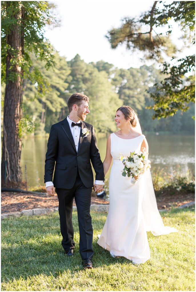 Bride and groom by lake | Summer Wedding | Angus Barn Wedding | Angus Barn Wedding Photographer | Raleigh NC Wedding Photographer
