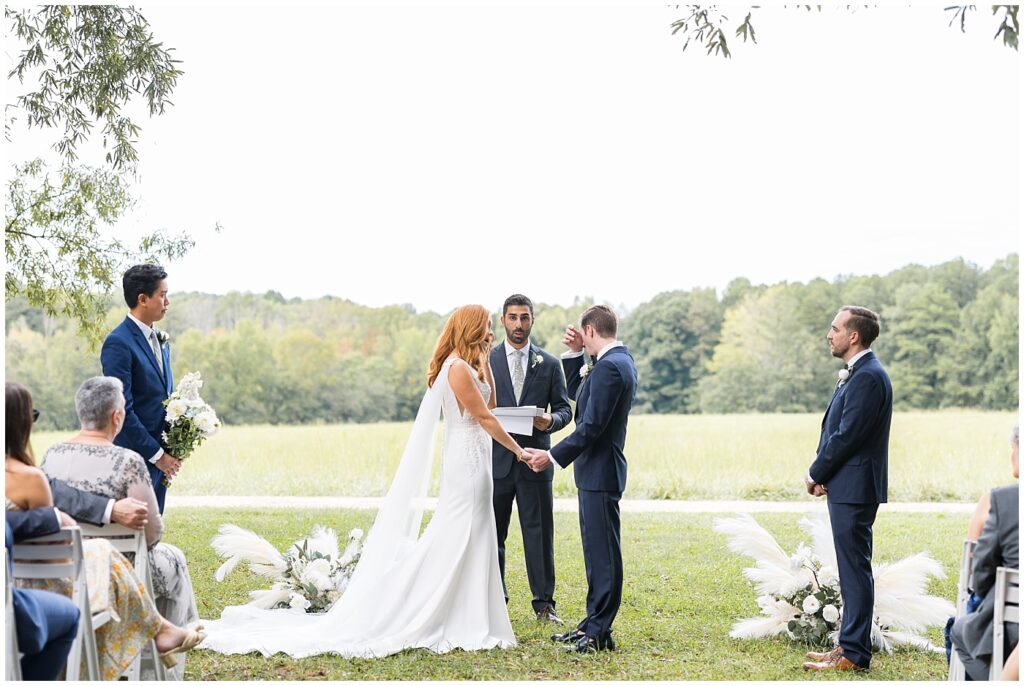 Groom wiping tears during wedding ceremony | The Meadows Wedding | The Meadows Wedding Photographer | Raleigh NC Wedding Photographer