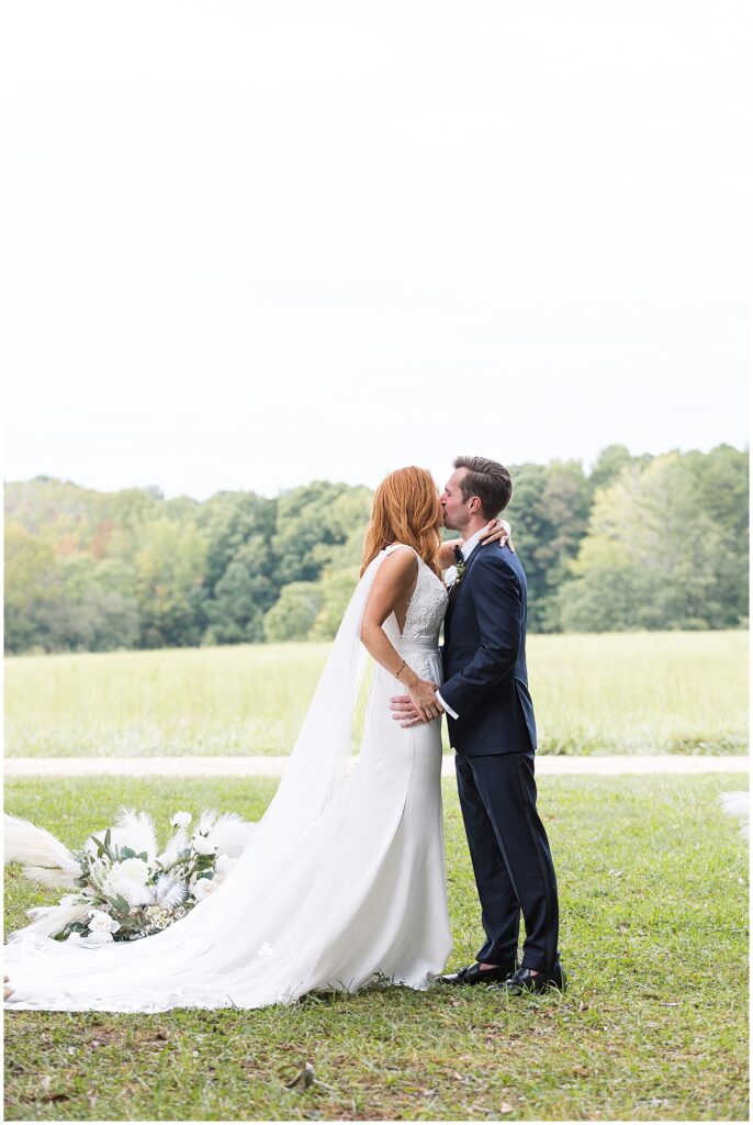 Bride and groom first kiss after wedding ceremony | The Meadows Wedding | The Meadows Wedding Photographer | Raleigh NC Wedding Photographer