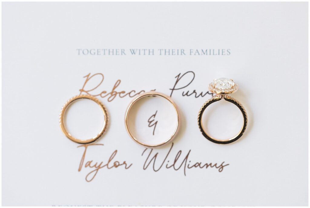 Wedding rings displayed over wedding invitation | The Meadows Wedding | The Meadows Wedding Photographer | Raleigh NC Wedding Photographer