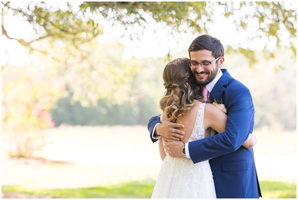Bride and brother embracing during first look | The Meadows Wedding | The Meadows Wedding Photographer | Raleigh NC Wedding Photographer