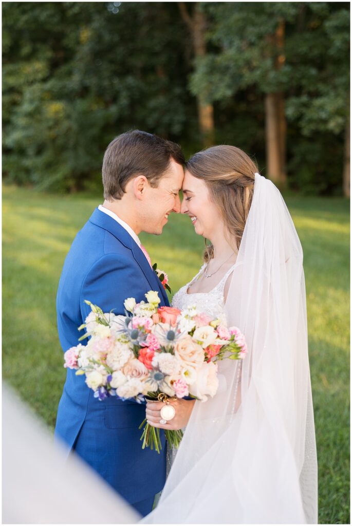 Bride and groom with flower bouquet | The Meadows Wedding | The Meadows Wedding Photographer | Raleigh NC Wedding Photographer
