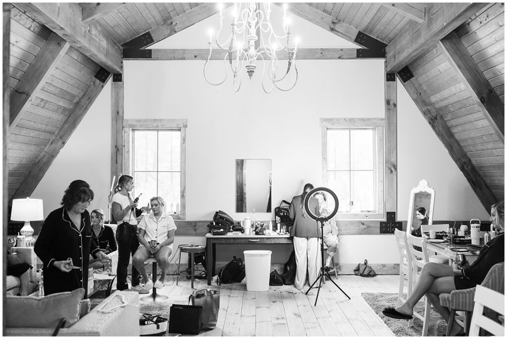 Black and white bridal suite with girls getting hair and makeup done | Raleigh Wedding Photographer