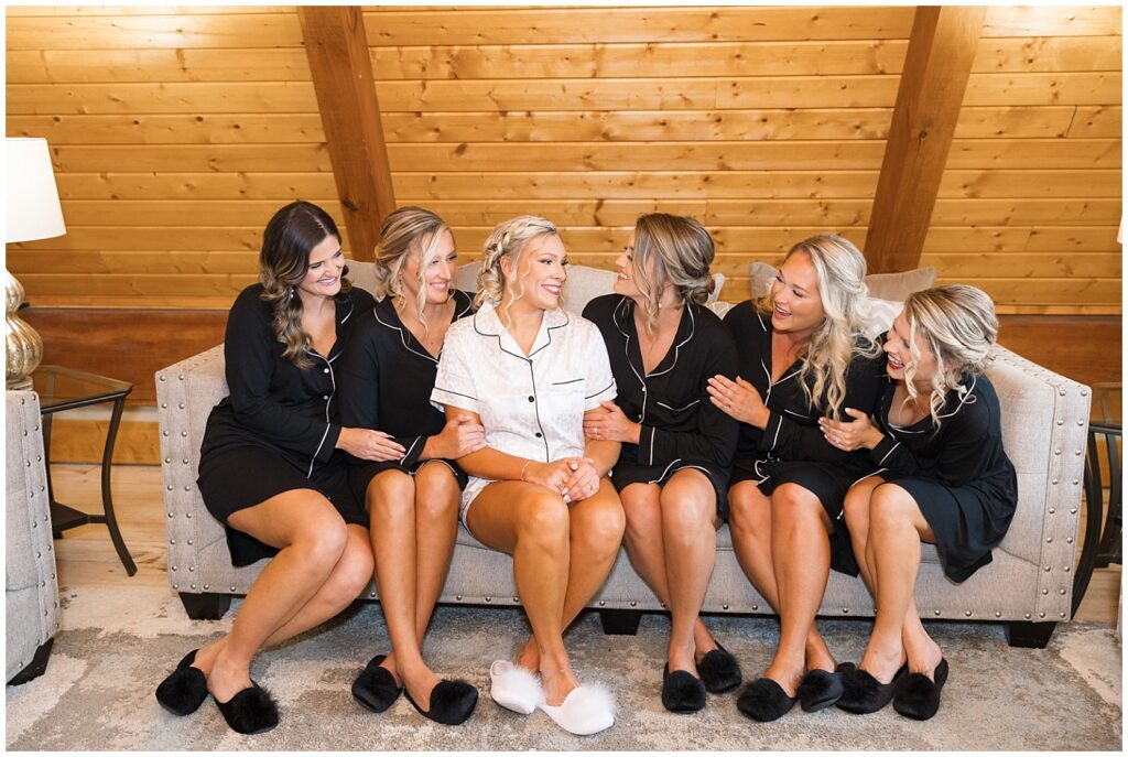 Bridesmaid PJ Photos with black pajamas in a barn | Pavilion at Carriage Farm Wedding