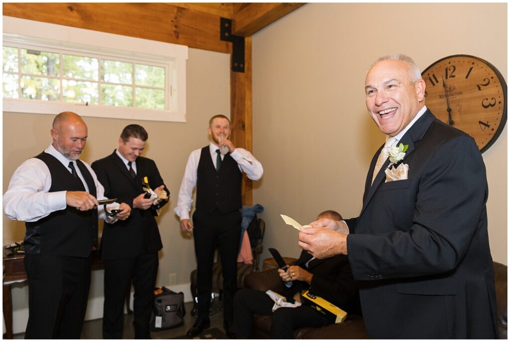 Groomsmen getting ready and gifts before the ceremony  | Raleigh NC Wedding Photographer 