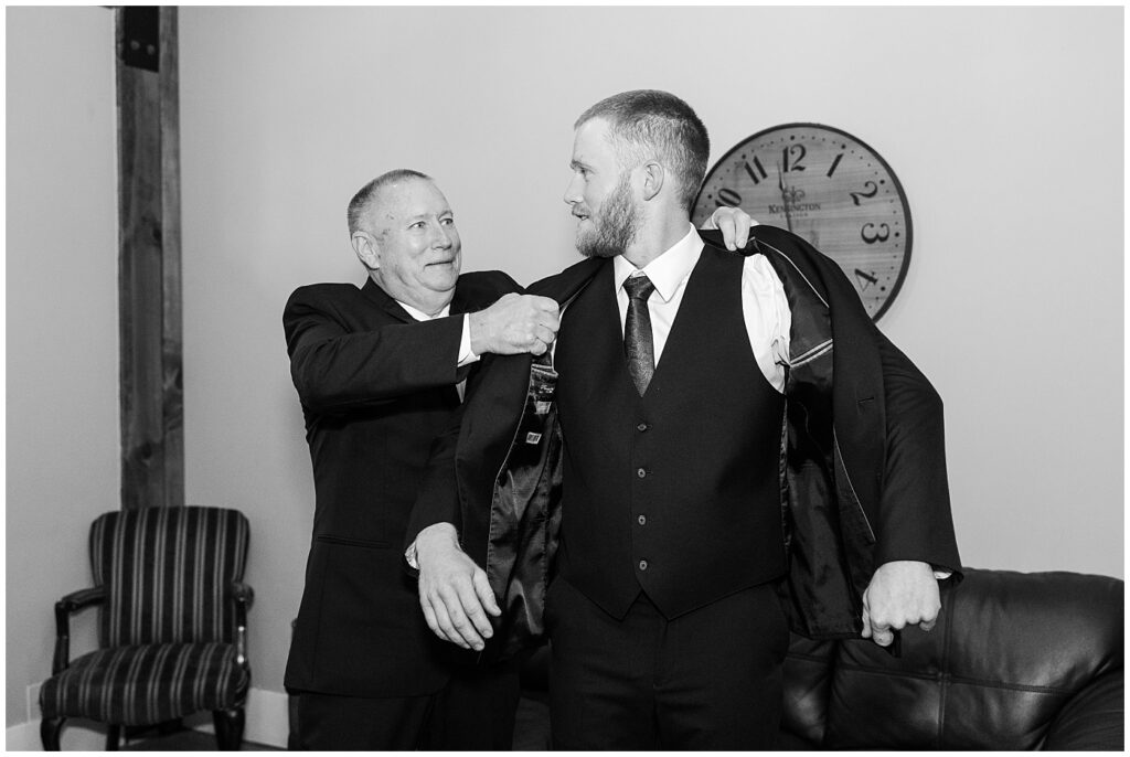 Groom getting ready with his dad in the groom suite | Raleigh NC Wedding Photographer