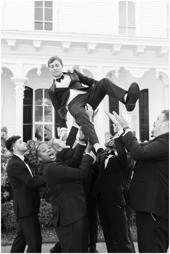Groomsmen Tossing Groom in Air | Merrimon-Wynne Wedding | Raleigh NC Wedding Photographer 