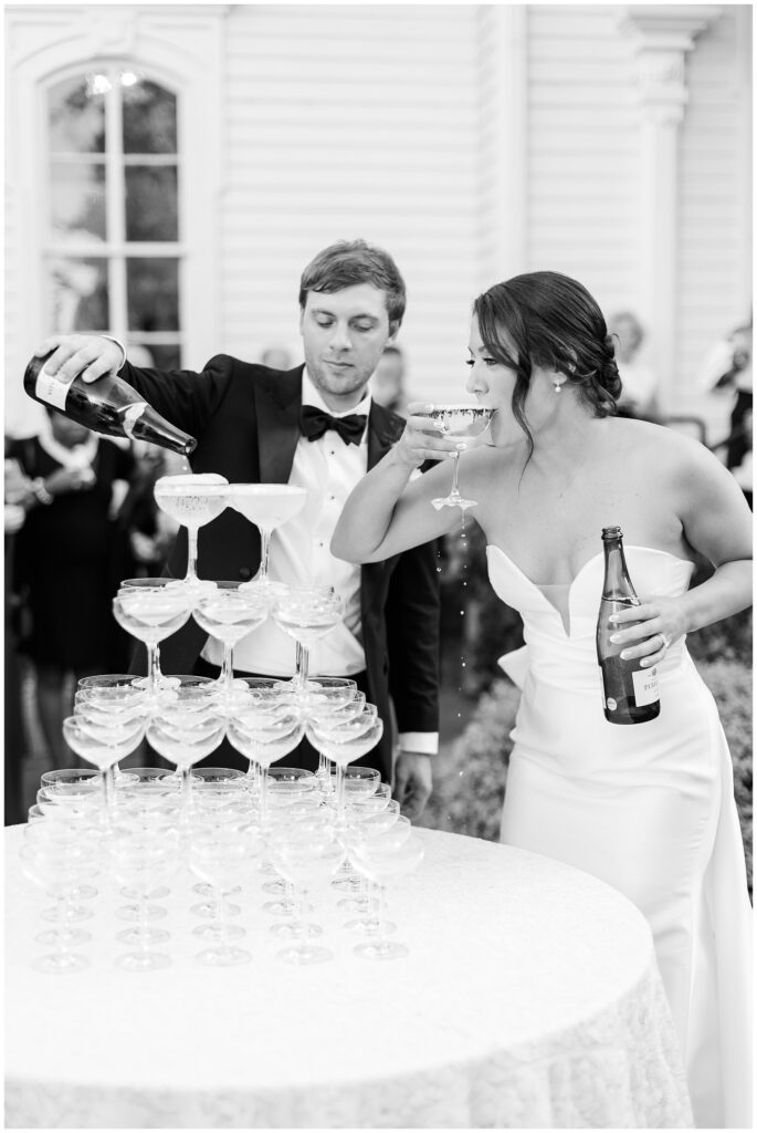 Bride and Groom Pouring Champagne | Merrimon-Wynne Wedding | Raleigh NC Wedding Photographer 