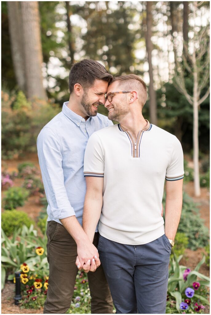 Spring Engagement at WRAL Gardens | Same Sex Couple Holding Hands in Garden | Raleigh Engagement Photos