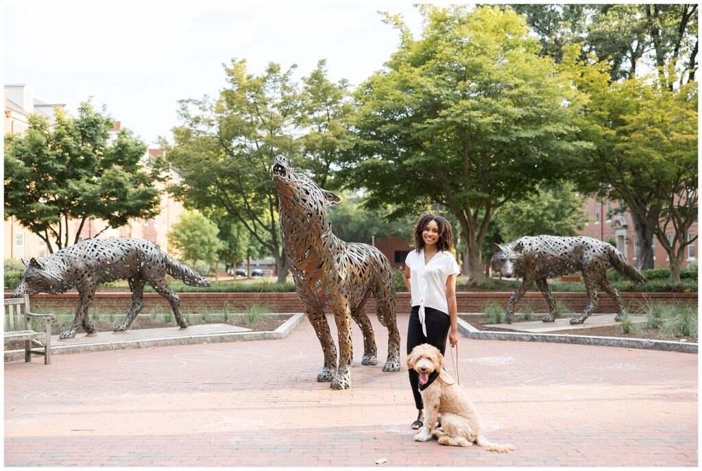 NCSU Senior Photos on Campus In Raleigh, North Carolina | NC State Wolf statues | NC State Grad Photographer | Grad Photos with Dogs