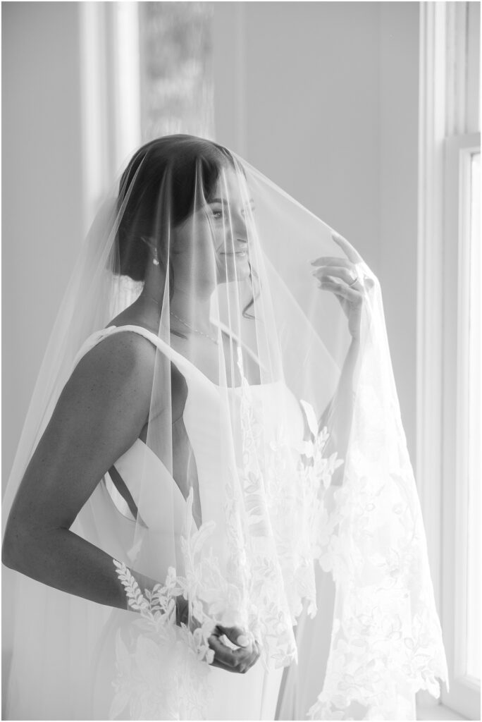 Modern bridal portrait with romantic window lighting in black and white under the veil | Raleigh NC Wedding Photographer 