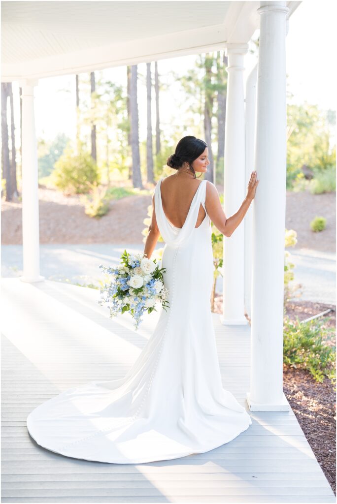 Bride Wedding Dress Inspiration with a custom design | Bridal Portraits by White Pillars on a southern porch | Bridal Portraits at The Upchurch 