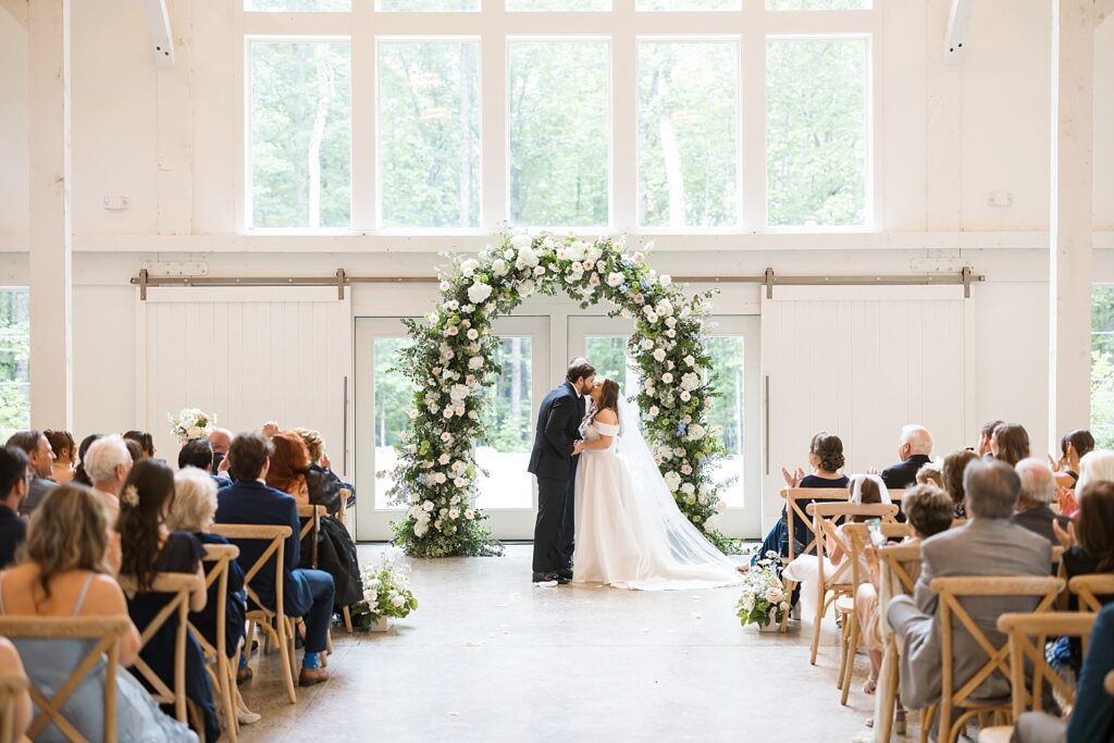 floral arch | first kiss | carolina grove wedding | carolina grove wedding photographer | classic wedding venue 