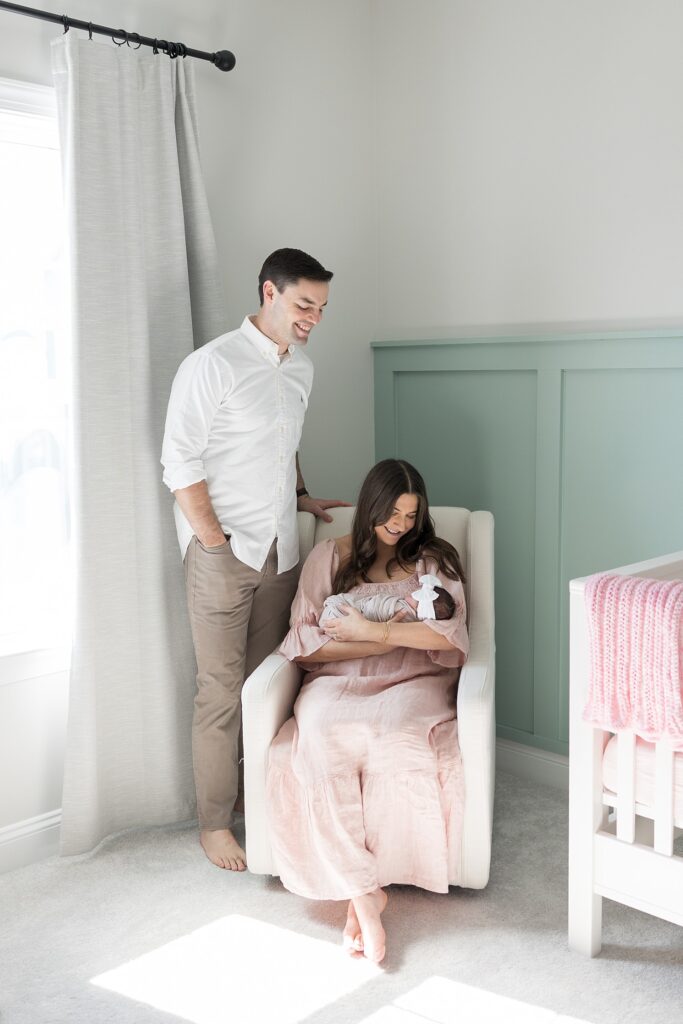 new parents | newborn photography Raleigh NC | baby girl newborn session | swaddled baby girl | lifestyle family photography | lifestyle nursery photos