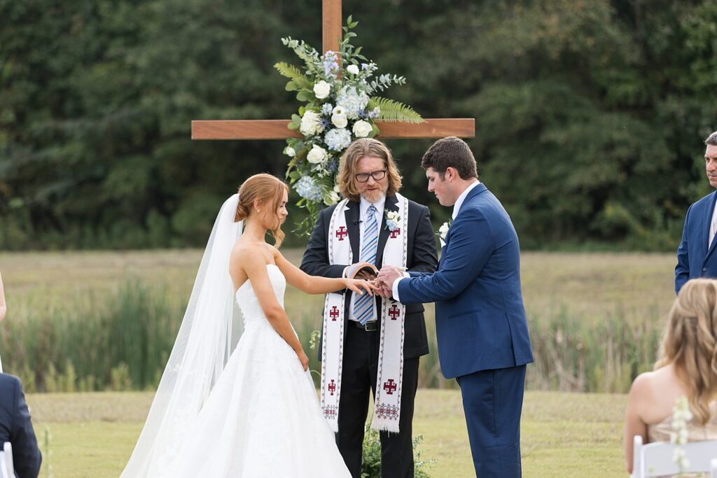 wedding ceremony, wedding vows, wedding ring exchange, outdoor wedding, the legacy at willow pond, historic venues in Virginia, Raleigh wedding photographer